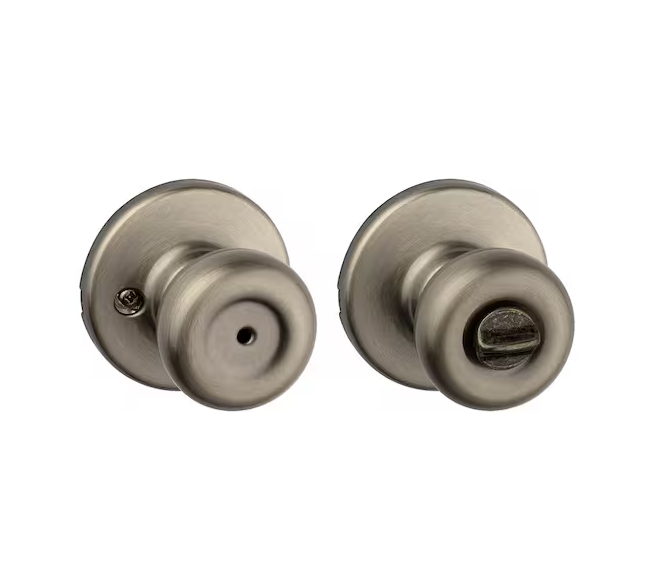Tylo Antique Brass Bed/Bath Door Knob Featuring Microban Antimicrobial Technology with Lock